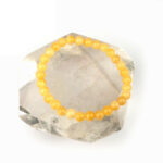 Orangencalcit Ø 6 mm Kugel Edelstein Armband flexibel und dehnbar Edelsteine Heilsteine bei Wunderstein24