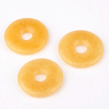 Orangencalcit | Calcit Donut Anhänger Ø 33 mm Edelsteine Heilsteine bei Wunderstein24